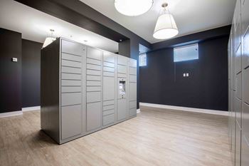 A lockers room in a room with a wood floor and blue walls